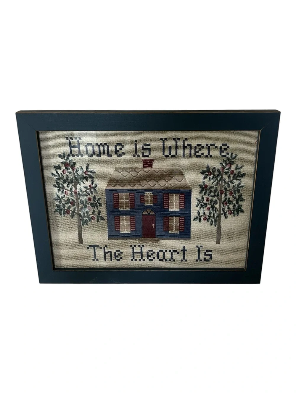 vintage “home is where the heart is” framed folk art cross-stitch piece